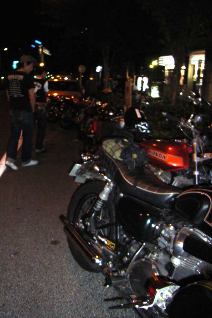 Motorbikes line the street outside Club Doctor